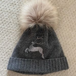 Reindeer bedazzled lambswool ski hat with real fur pom-pom.